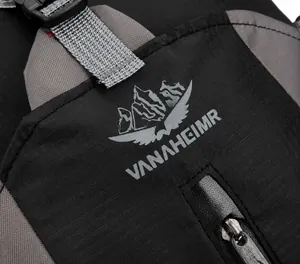 Detailed macro view of water-resistant nylon fabric and logo on outdoor backpack