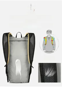Detail of wide breathable mesh shoulder straps on a lightweight gray foldable backpack