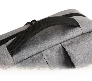 Macro shot of reinforced widened and thickened handle on the gray business backpack