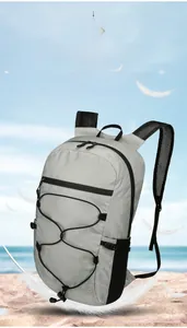 Detail of light grey grid fabric and breathable mesh straps on folding outdoor backpack