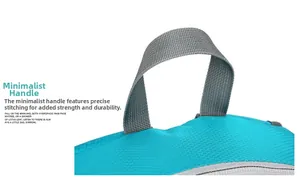 Detail of reinforced gray top handle stitching on blue waterproof folding backpack