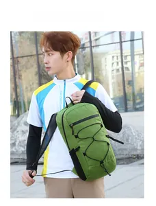 Close-up of a vibrant green outdoor chest bag with mesh strap and elastic bungee cord system