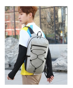 Light gray waterproof outdoor backpack with adjustable elastic cord system for hiking