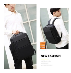 Detail view of black waterproof business laptop backpack featuring integrated USB charging port