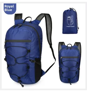 Detail view of sapphire blue foldable nylon backpack with mesh straps and storage pouch