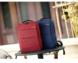 Detail view of water-resistant polyester backpacks with external USB charging ports