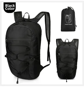 Detail of foldable black outdoor backpack with waterproof ripstop nylon and bungee cord
