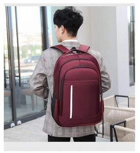 Side view of a burgundy business laptop backpack with white vertical stripe and mesh pocket