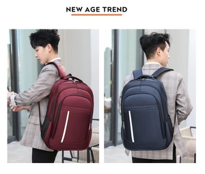 Detail of burgundy and navy business backpacks with reflective stripes and mesh side pockets