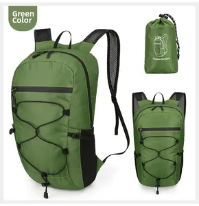 Detailed view of grass green foldable backpack with ripstop fabric and mesh straps