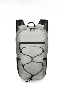 Front view of silver-grey waterproof hiking backpack with ripstop fabric and mesh straps