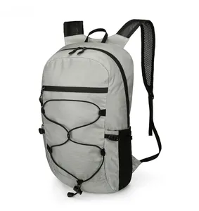 Side view of foldable waterproof hiking backpack with bungee cords and mesh pockets