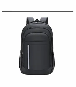 Detail of black business backpack featuring waterproof fabric and safety reflective strip