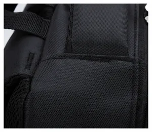 Detail showing reinforced stitching and heavy-duty nylon webbing on the black laptop backpack