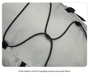 Detail of outdoor backpack with front bungee cord system for carrying extra accessories