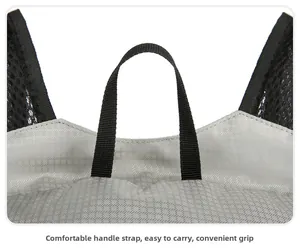 Detail of grey ripstop hiking backpack showing reinforced nylon handle and mesh straps