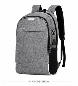 Détail du sac à dos d'affaires gris avec port de charge USB intégré et poche latérale en filet