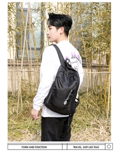 Detail of water-resistant black travel backpack featuring white Vanaheimr side logo