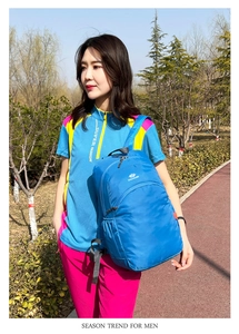 Outdoor shot of lightweight blue waterproof backpack for hiking and travel use