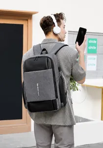 Business backpack for men with USB charging port shown in a street commuting scene