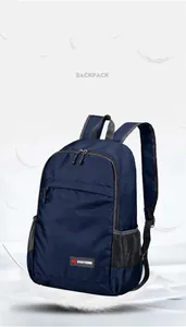Detail showing the ultra-lightweight dark blue foldable backpack with feather visuals