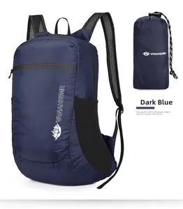 Detail of navy blue foldable backpack with breathable mesh straps and storage pouch