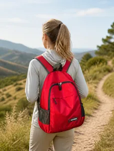 Outdoor view of lightweight red foldable backpack with water-resistant grid pattern