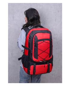 Detail view of large capacity waterproof hiking backpack with red and black color scheme
