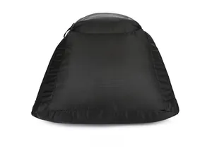 Macro detail of the black mesh fabric and zipper closure on the base of this sports backpack