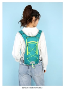 Detail view of lightweight cycling backpack with breathable straps on a female model