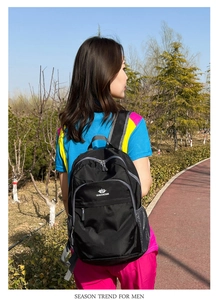 Detail shot of lightweight waterproof black backpack with Vanaheimr logo on side pocket