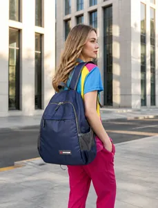 Navy blue nylon backpack featuring main zip pocket and mesh side pouches for outdoor use