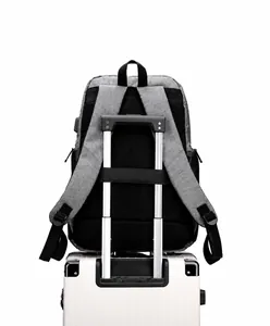Detail of business backpack with trolley strap and USB port on luggage handle