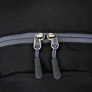 Detail of tear-resistant grid fabric with dual metal zippers and grey woven pullers