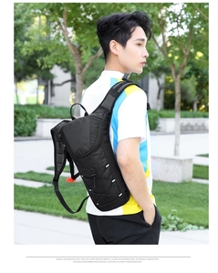 Detail of professional cycling backpack featuring breathable mesh straps and reflective strips