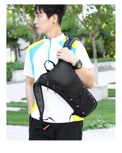 Close-up of black lightweight cycling backpack with elastic cords and mesh fabric