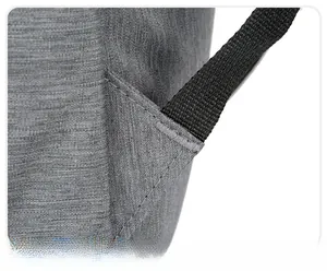 Détail de la couture triangulaire renforcée et du point d'arrêt sur les bretelles grises
