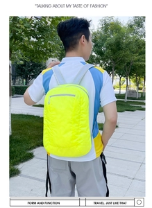 Outdoor shot of the lightweight fluorescent yellow foldable backpack with breathable straps