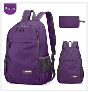Detail view of purple foldable backpack with ripstop nylon texture and mesh side pockets