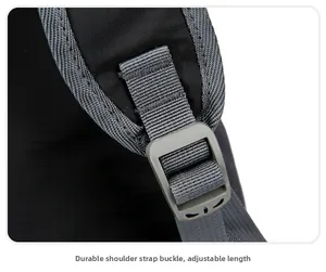 Detail of sturdy adjustable buckle and grey woven shoulder strap on black nylon backpack