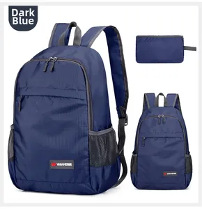 Detail of navy blue foldable backpack showing ripstop nylon fabric and compact storage pouch