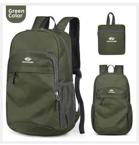 Close-up of green water-resistant folding backpack with mesh pocket and logo detail