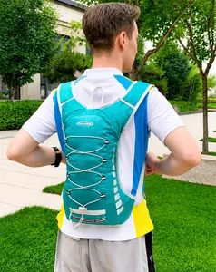 Detail of teal cycling backpack featuring reflective logo and breathable mesh shoulder straps