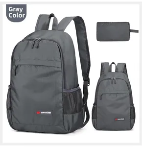 Macro detail of foldable grey backpack featuring durable ripstop fabric and mesh side pockets
