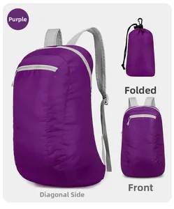 Detail view of purple foldable backpack showing front pocket and compact storage form