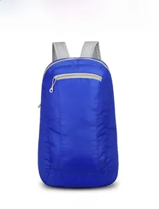 Front view of blue folding backpack showing waterproof nylon fabric and zipper pocket
