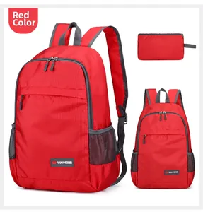 Detail view of red foldable backpack with mesh pockets and matching storage pouch
