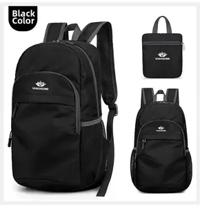 Collapsible black nylon travel backpack showing folded state and mesh side pockets