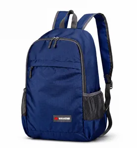 Detailed side view of navy blue foldable backpack with gray mesh side pockets