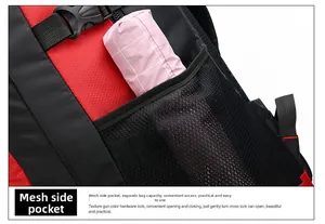 Detail of red and black outdoor backpack featuring a mesh side pocket with a folded umbrella